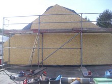 Giebelwand gedämmt und mit Kunstschiefer neu bekleidet