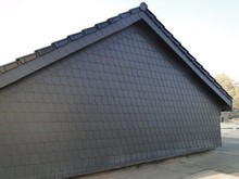 Giebelwand gedämmt und mit Kunstschiefer neu bekleidet